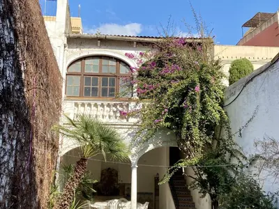 a building with a bunch of flowers on it at El masnou in Masnou