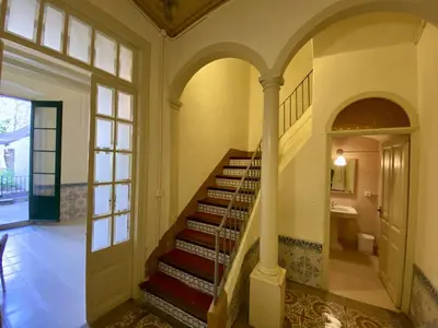 a staircase in a house with aoyer with a window at El masnou in Masnou