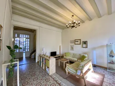 a living room with a couch and a table at El masnou in Masnou