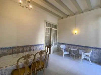 a dining room with a table and chairs at El masnou in Masnou