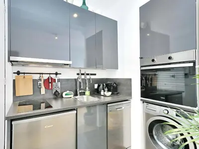a kitchen with stainless steel appliances and a dishwasher at Casa nanit apt d in Hospitalet de Llobregat