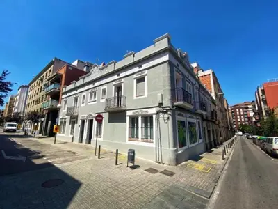 a building on the side of a city street at Casa nanit apt d in Hospitalet de Llobregat
