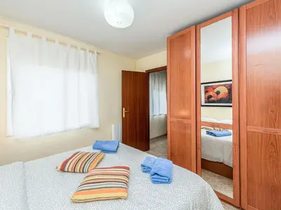 a bedroom with a bed with two pillows on it at Apartment Camp Nou by Interhome in Barcelona