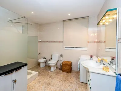 a bathroom with a toilet and a sink at Apartment Camp Nou by Interhome in Barcelona