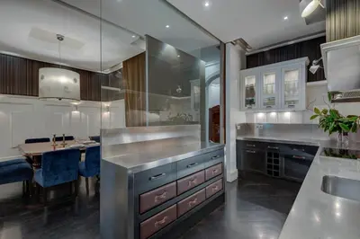 a kitchen with a dining table and a counter top at SuiteaBcn II in Barcelona