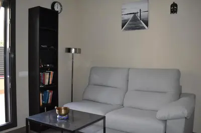 a living room with a couch and a table at Apartamento Arenys de Munt - Costa Barcelona, Maresme - in Arenys de Munt
