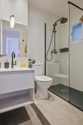 a bathroom with a sink and a toilet and a shower at Habitat Apartments Plaza España Urban in Barcelona