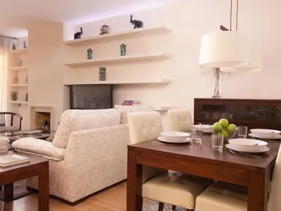 a living room with a table and a couch at Click&Flat Luxury mistral in Barcelona