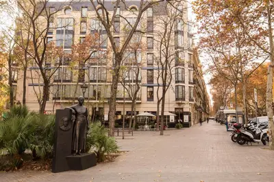 a statue of a man in front of a building at We Boutique Hotel Barcelona in Barcelona