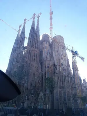 a large building with cranes on top of it at Apartamento Sagrada Familia in Barcelona