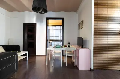 a living room with a table and a dining room at 1814 - AB Sagrada Família Cartagena in Barcelona
