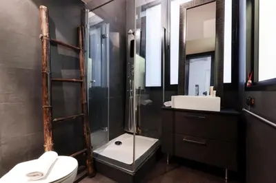 a bathroom with a shower and a toilet and a sink at 1814 - AB Sagrada Família Cartagena in Barcelona