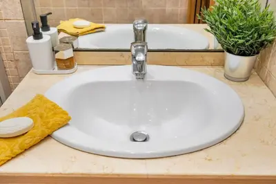 a white sink in a bathroom with a tub at Lodging Apartments Villa de Gracia 2 bedroom cozy apartment in Barcelona