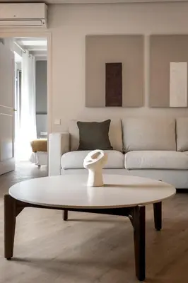 a living room with a couch and a coffee table at Mirador 1840 in Barcelona
