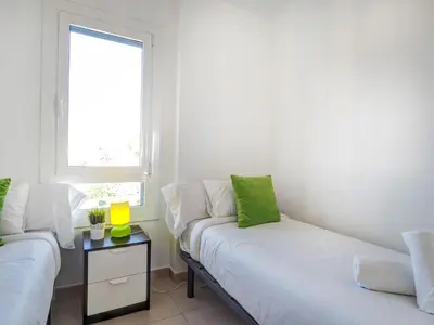 a living room with a couch and a window at Balmins White by Hello Homes Sitges in Sitges