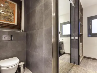 a bathroom with a toilet and a sink at Click&Flat Luxury cabanyes in Barcelona