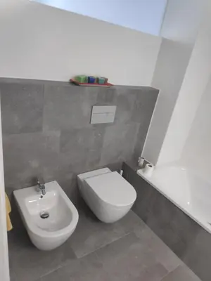 a bathroom with a toilet and a bidet at Apartment with a view close to the beach in Badalona