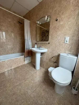 a bathroom with a toilet and a sink at COLIBRI in Calella