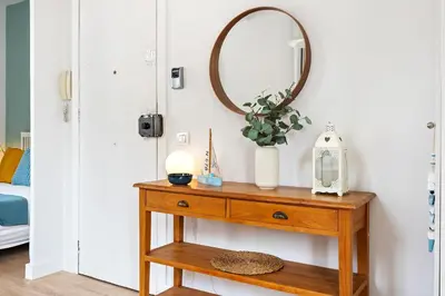a dressing table with a mirror on a wall at Lodging Apartments Barceloneta Beach Studio 42 in Barcelona