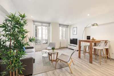 a living room with a couch and a table at Sitges Group Blue&White in Sitges