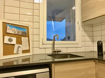 a kitchen with a sink and a window at MonResidence Cavall Bernat in Manresa