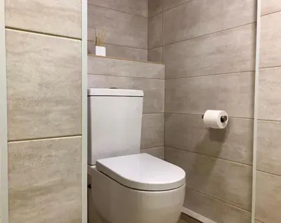 a bathroom with a toilet and a roll of toilet paper at MonResidence Cavall Bernat in Manresa