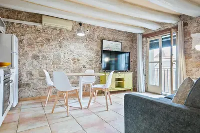 a living room with a table and chairs at Alcam Santa Monica in Barcelona
