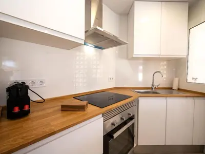 a kitchen with white cabinets and a sink at Apartment Blue Sea by Interhome in Cunit