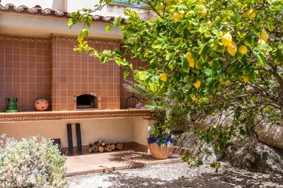 a house with a bunch of oranges on it at Mediterranean villa with pool near barcelona in Cabrera de Mar