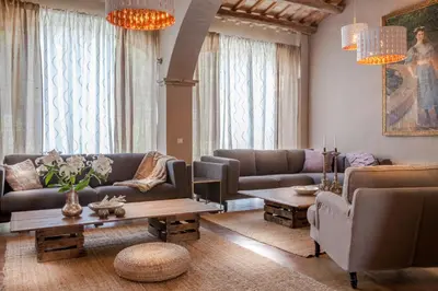 a living room with couches and a coffee table at Masia Victoria in Sant Pere de Ribes
