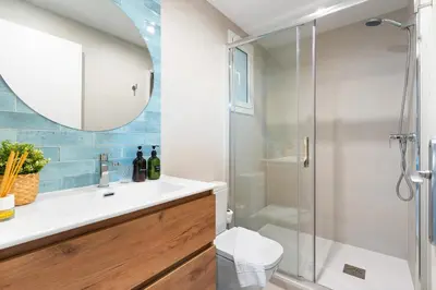 a bathroom with a shower and a sink at Lodging Apartments Barceloneta Beach Studio 12 in Barcelona