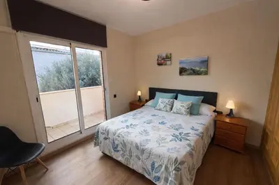 a bedroom with a bed and a large window at Catalunya Casas Stunning Villa with private pool 33 km to Barcelona in Senmanat