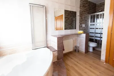 a bathroom with a toilet and a sink and a mirror at Catalunya Casas Stunning Villa with private pool 33 km to Barcelona in Senmanat