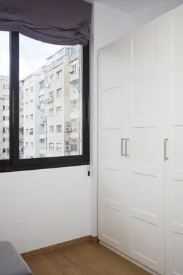 a white room with a window and a door at Stay U-nique Apartments Villarroel in Barcelona