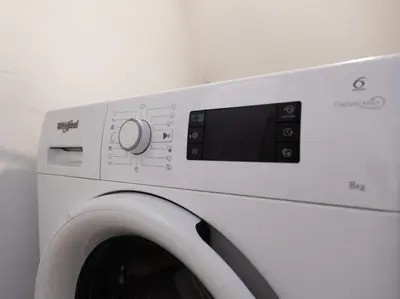 a white washing machine in a white room at Stay U-nique Apartments Estación del Norte in Barcelona