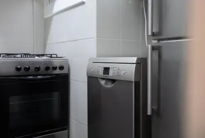 a kitchen with a stove and a refrigerator at Stay U-nique Apartments Estación del Norte in Barcelona