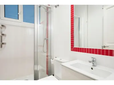 a white bathroom with a sink and a shower at Stay U-nique Apartments Napols I in Barcelona