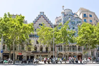 a group of motorcycles parked in front of a building at Stay U-nique Apartments Passeig de Gracia II in Barcelona