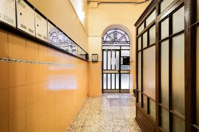 an empty hallway with a door in a building at Stay U-nique Apartments Carretes in Barcelona