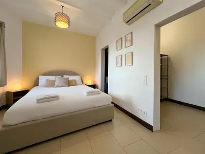 a bedroom with a large white bed in a room at Stay U-nique Apartments Pasteur in Barcelona