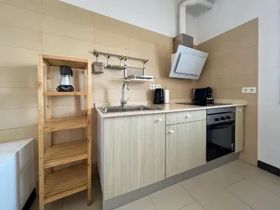 a small kitchen with a sink and a stove at Stay U-nique Apartments Pasteur in Barcelona