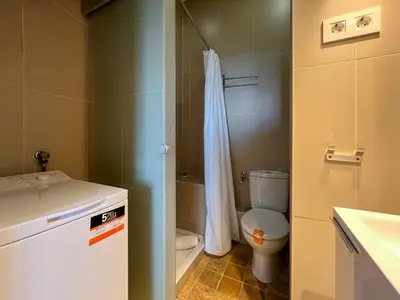 a bathroom with a toilet and a sink and a shower at Stay U-nique Apartments Pasteur in Barcelona