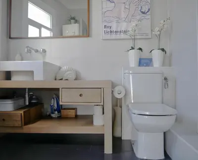 a bathroom with a white toilet and a sink at Stay U-nique Apartments Monec in Barcelona