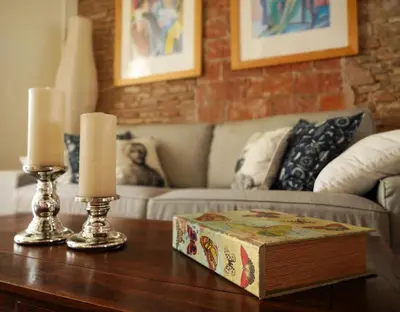 a living room with a table with two candles on it at Stay U-nique Apartments Monec in Barcelona