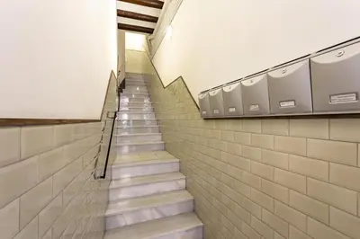 a staircase in a building with a stair case at Stay U-nique Apartments Parlament in Barcelona