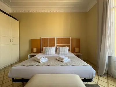 a bedroom with a large bed with towels on it at Stay U-nique Apartments Gran Via in Barcelona