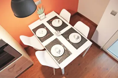 a dining room table with white chairs and a table at Urban Loft Barcelona Diagonal super ubicación wifi in Barcelona