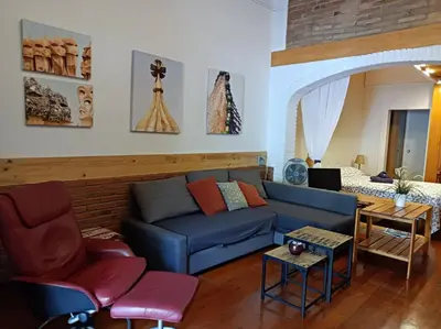 a living room with a blue couch and chairs at Urban Loft Barcelona Diagonal super ubicación wifi in Barcelona