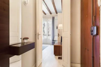 a hallway with a door leading to a room at Stay U-nique Apartments Manso in Barcelona