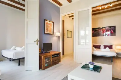 a living room with a tv and a couch at Stay U-nique Apartments Manso in Barcelona